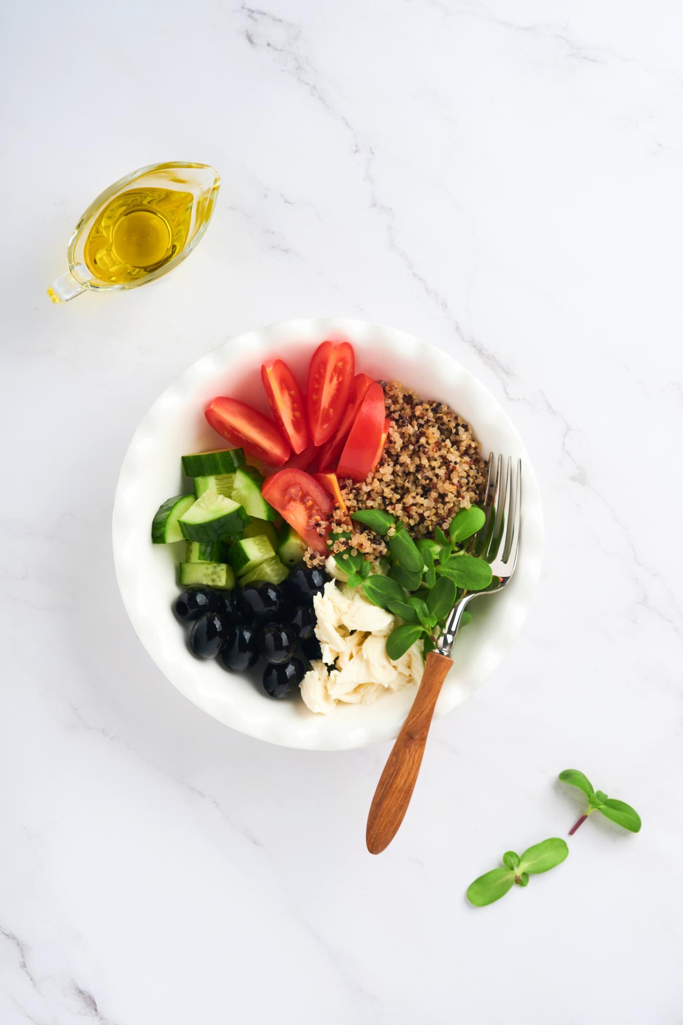 Bright bowl of ready-to-eat salad with grains