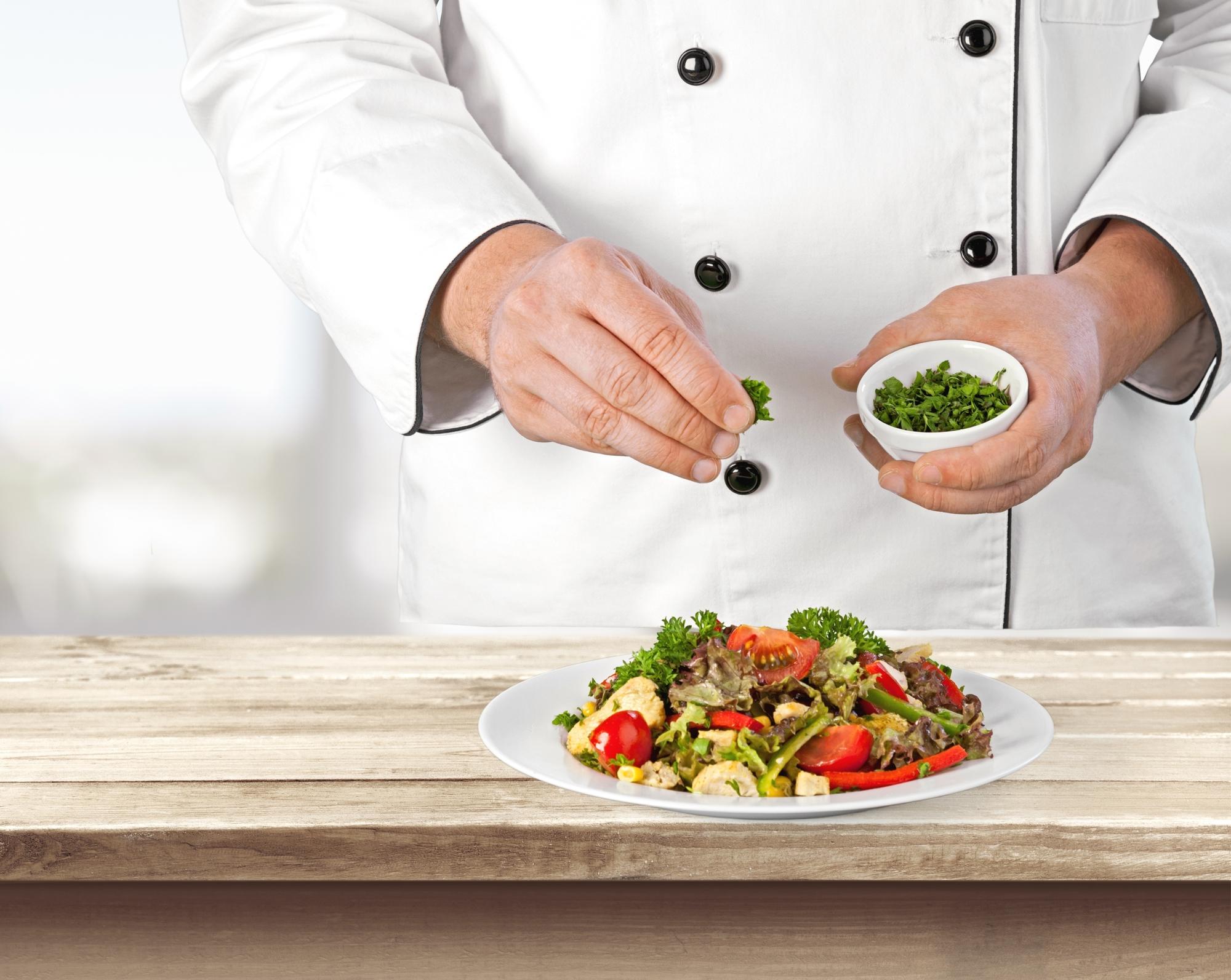 Chef preparing a colorful quick meal on a modern kitchen countertop